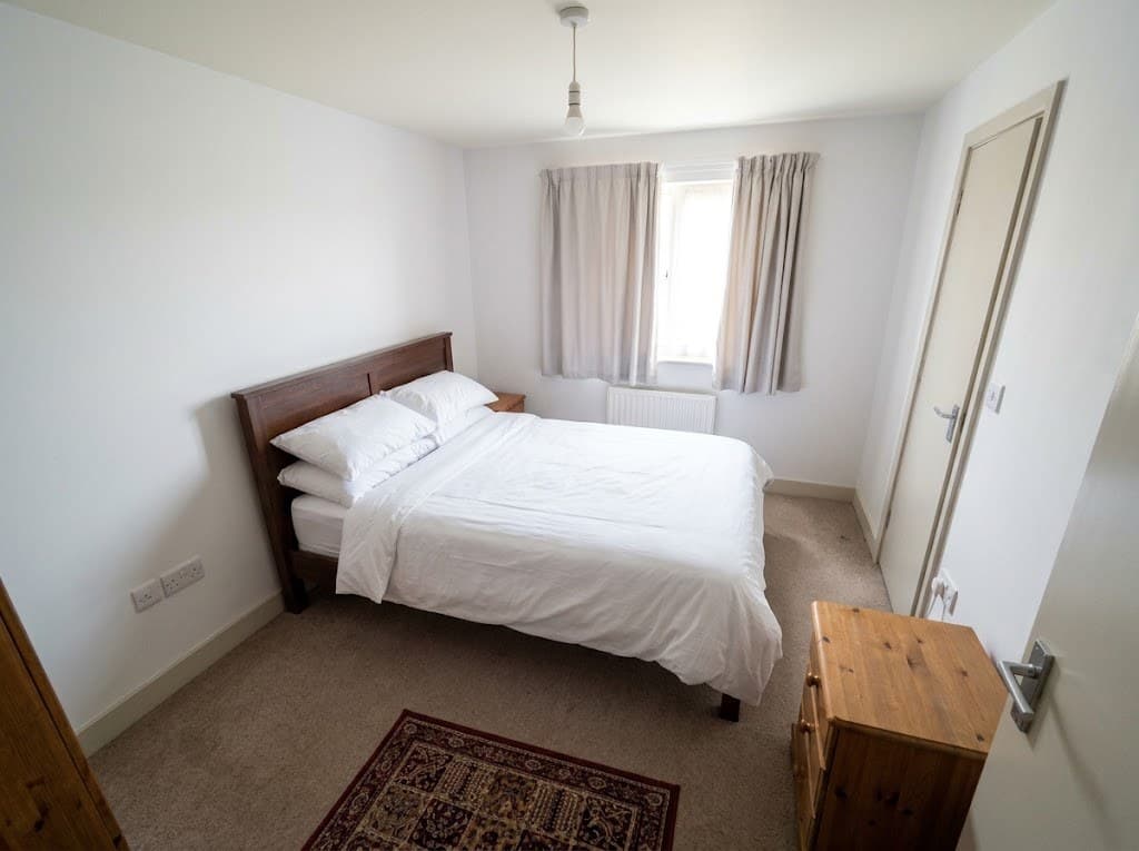 After: the same guest bedroom, enhanced